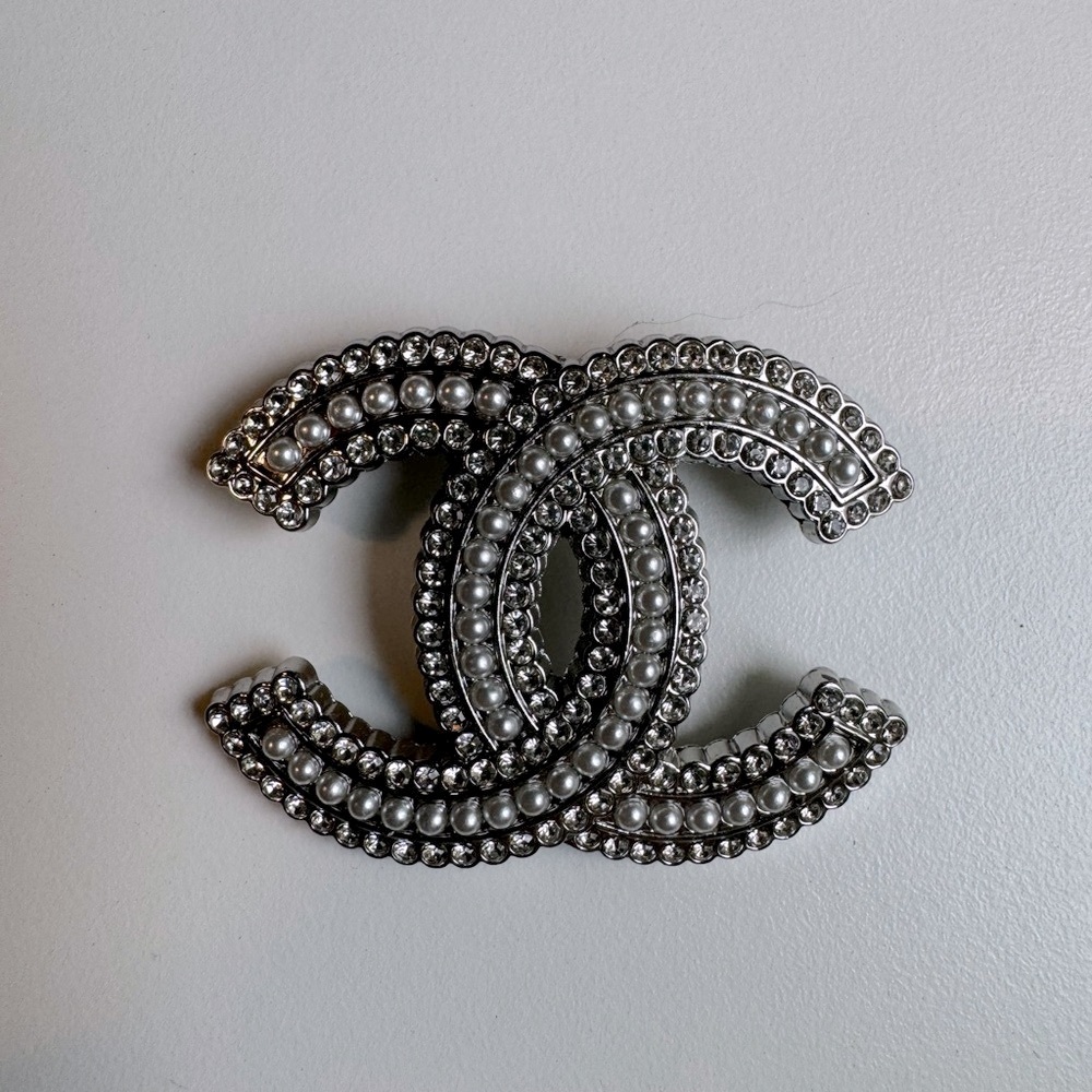 Chanel brooch.